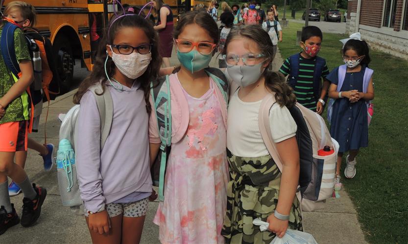 A group of students smiles